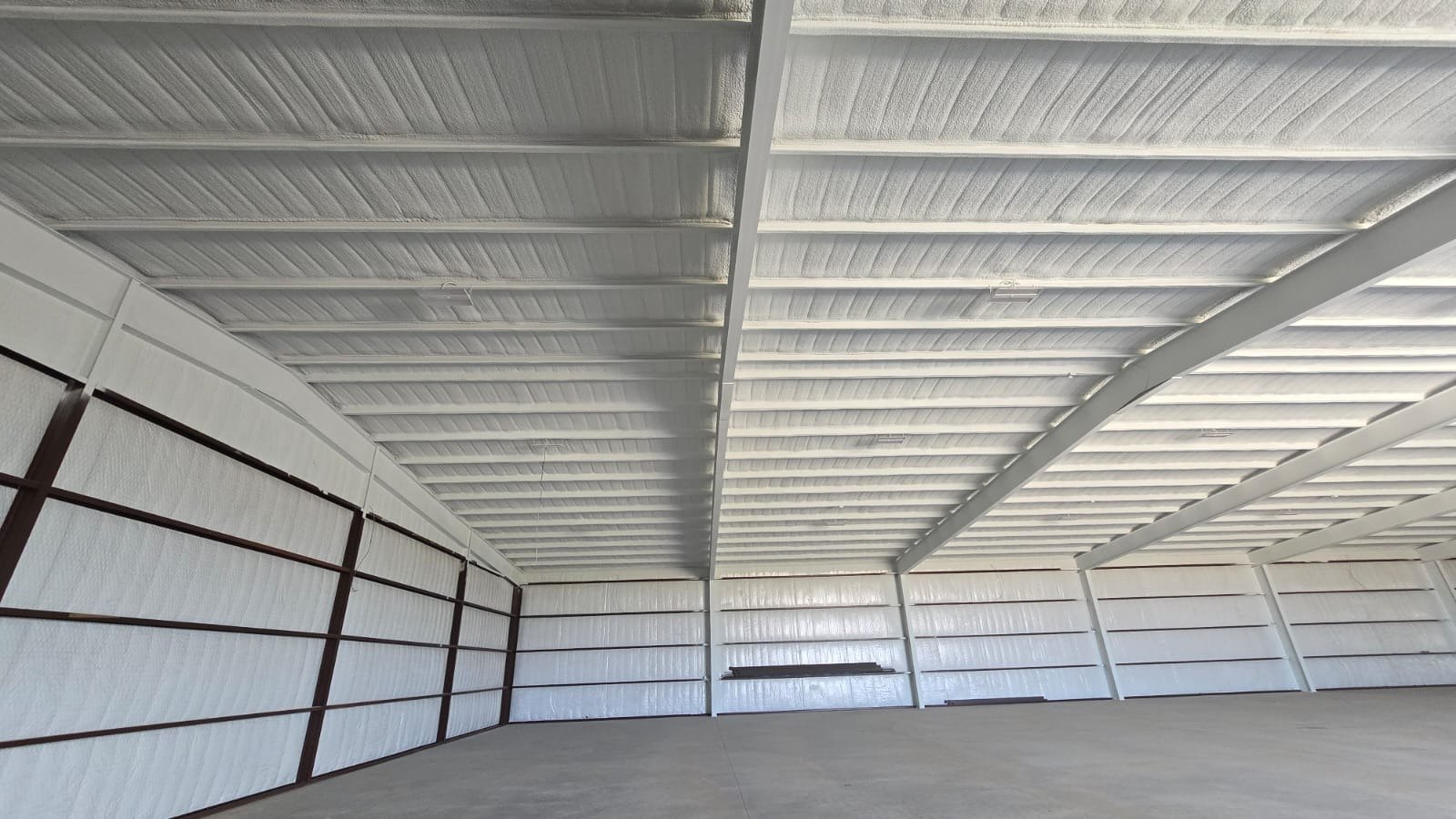 Spray foam insulation being applied to wall cavities — Desert Spray Foaming