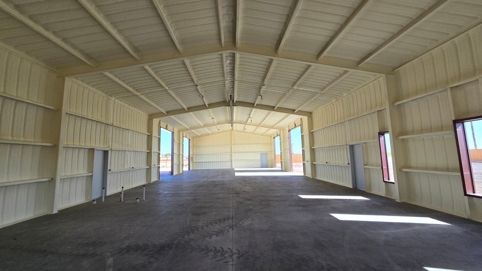 Closed-cell spray foam application on a metal building — Desert Spray Foaming