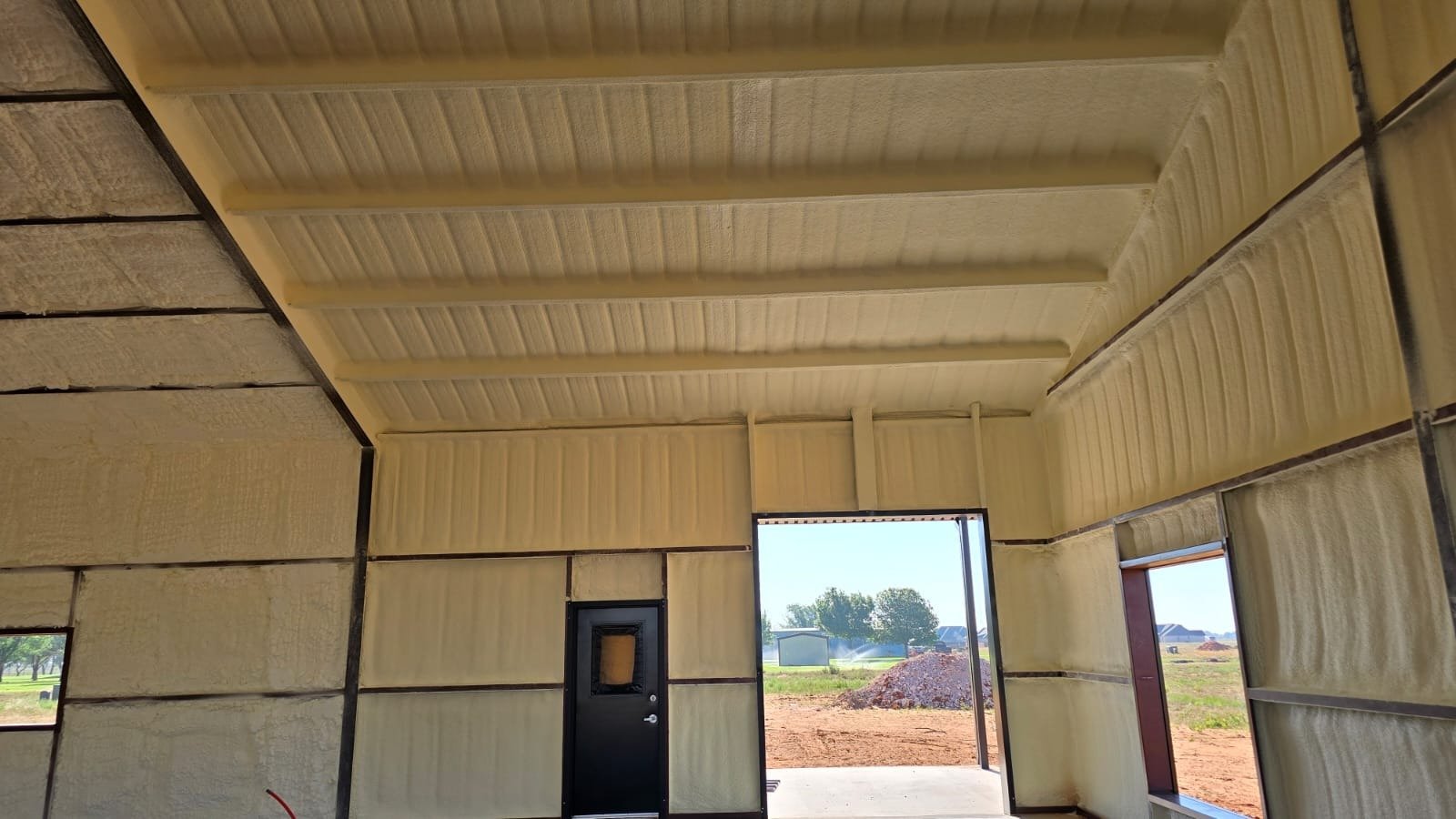 Metal building interior after spray foam insulation — Desert Spray Foaming