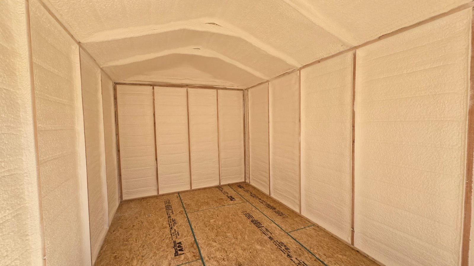 Spray foam insulation being applied to wall cavities — Desert Spray Foaming