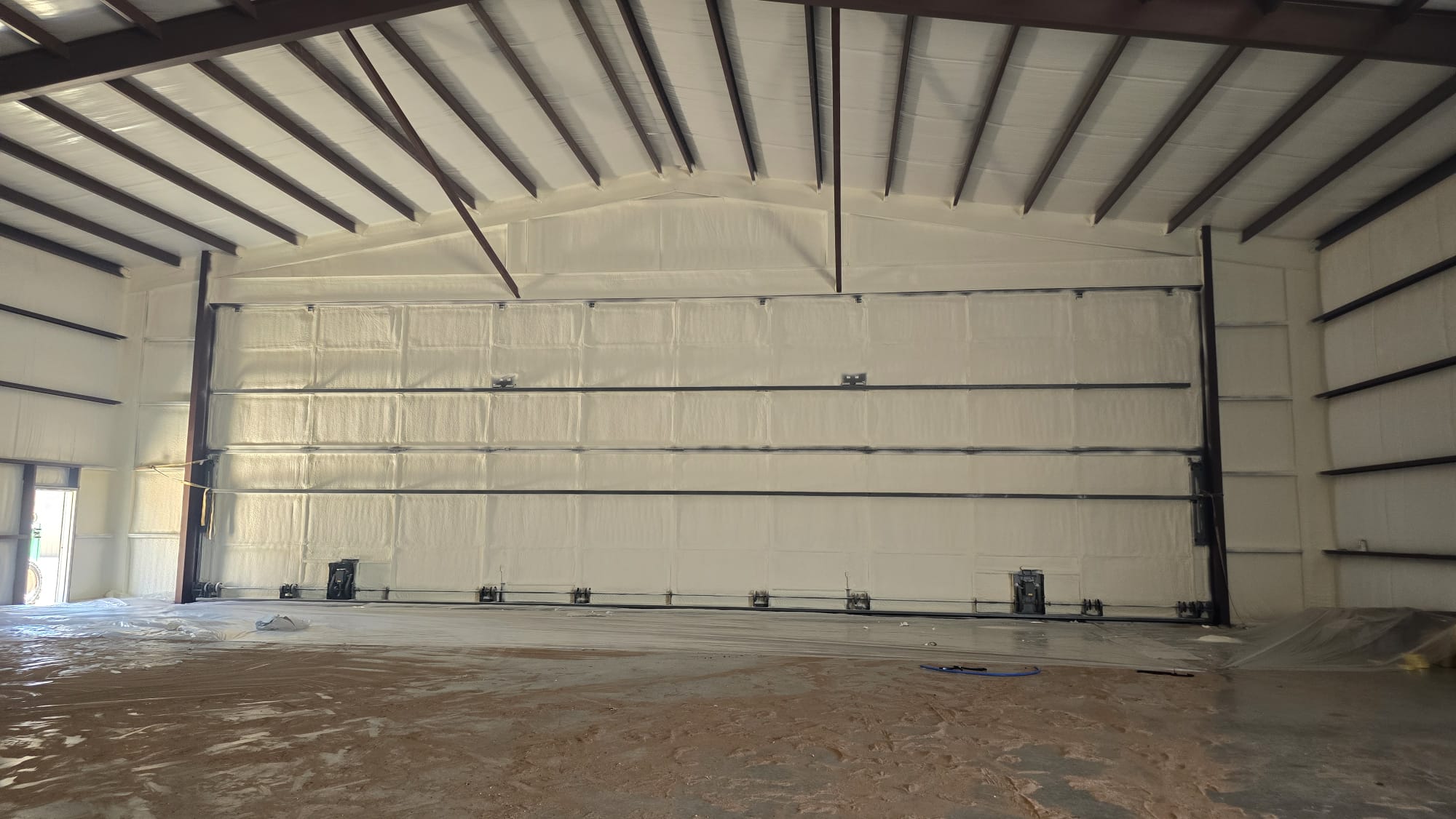 Closed-cell spray foam application on a metal building — Desert Spray Foaming
