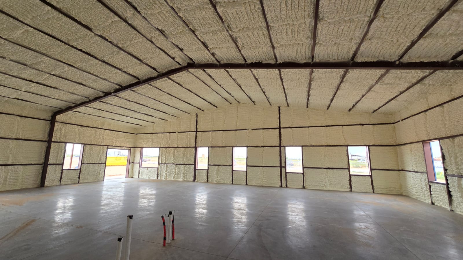 Spray foam insulation being applied to wall cavities — Desert Spray Foaming